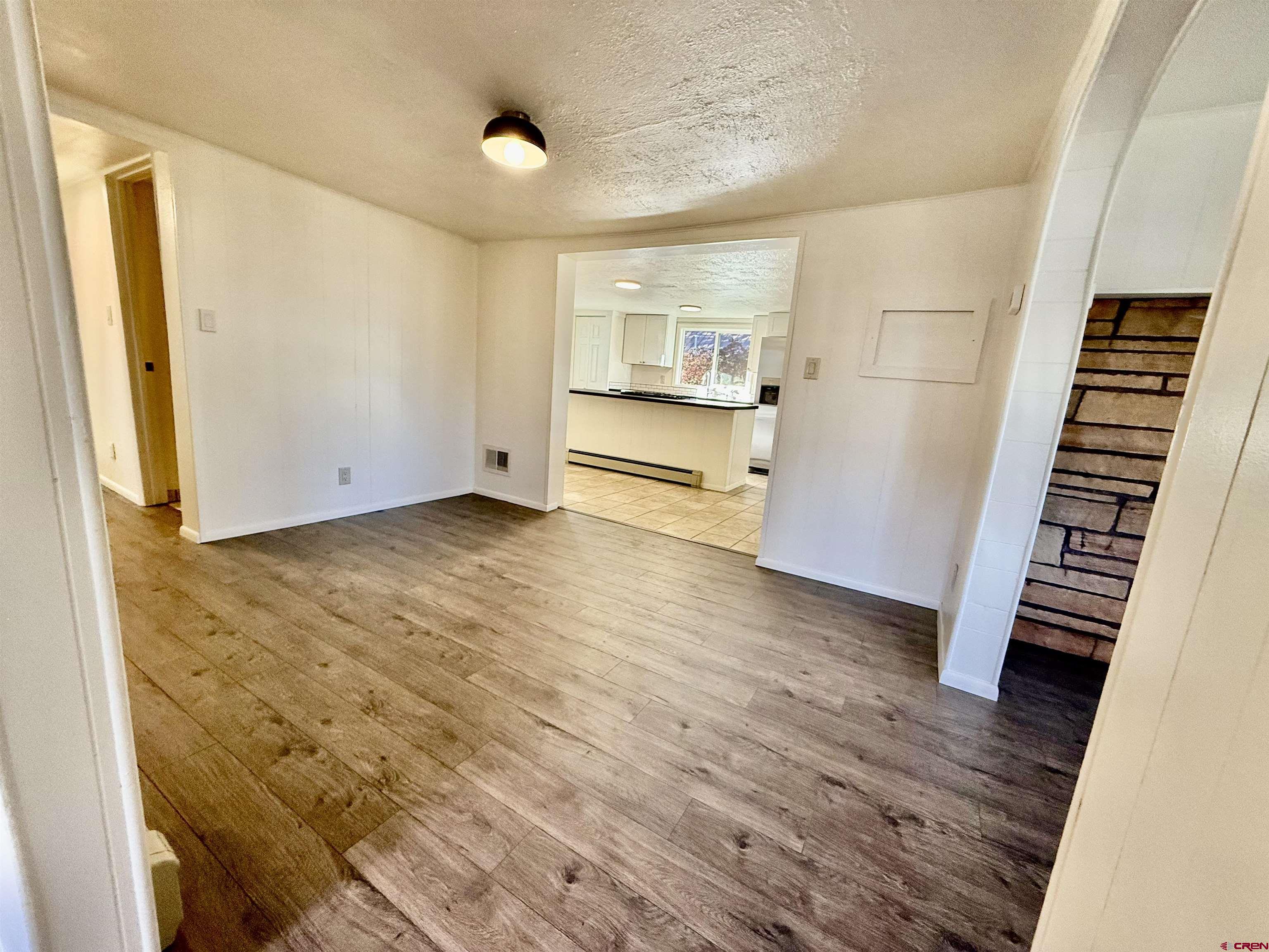 460 Fox Street Nucla, CO 81424 - Photo 11 of 33 a view of empty room with wooden floor