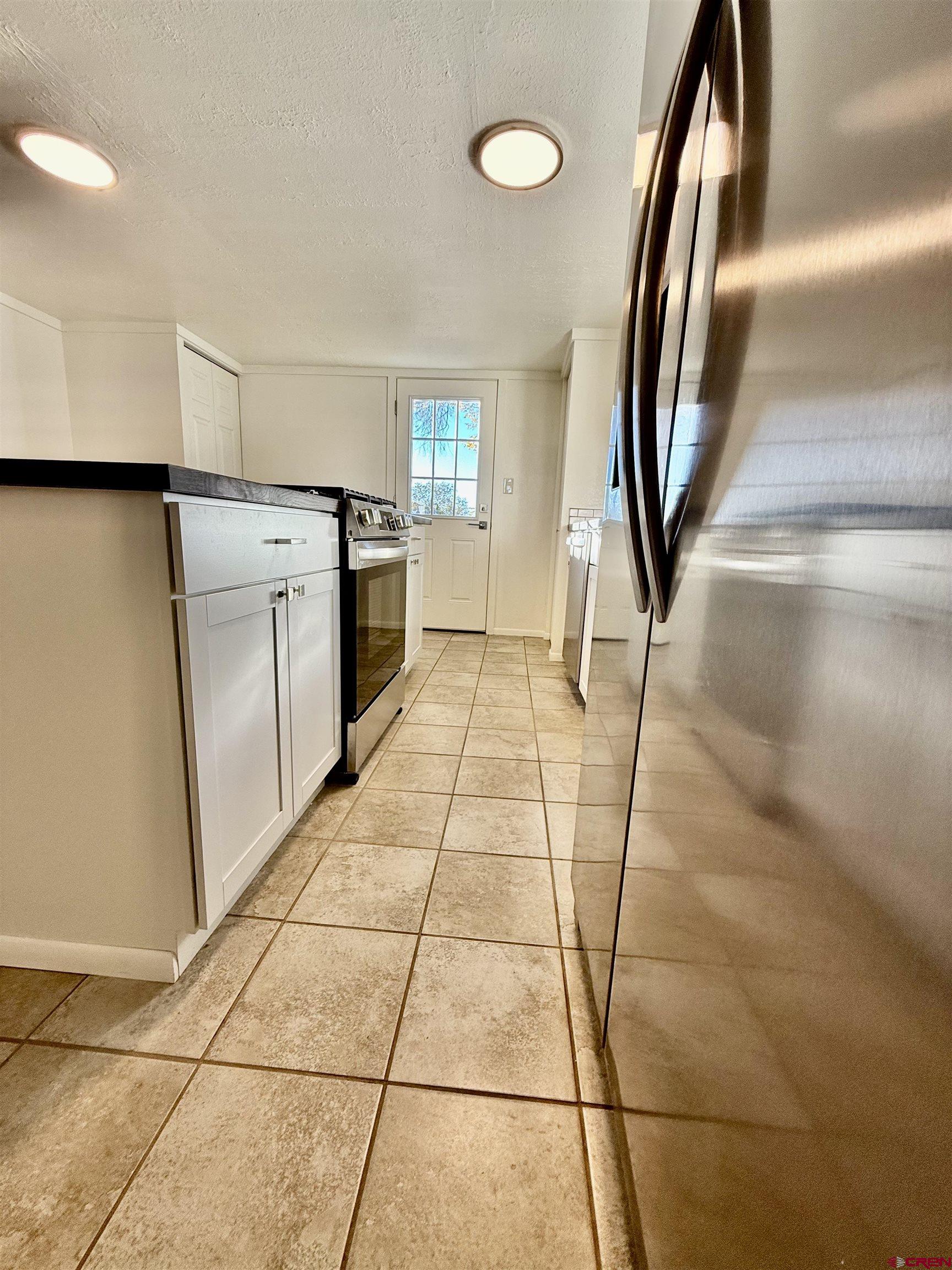 460 Fox Street Nucla, CO 81424 - Photo 18 of 33 a view of a kitchen with wooden floor and a sink