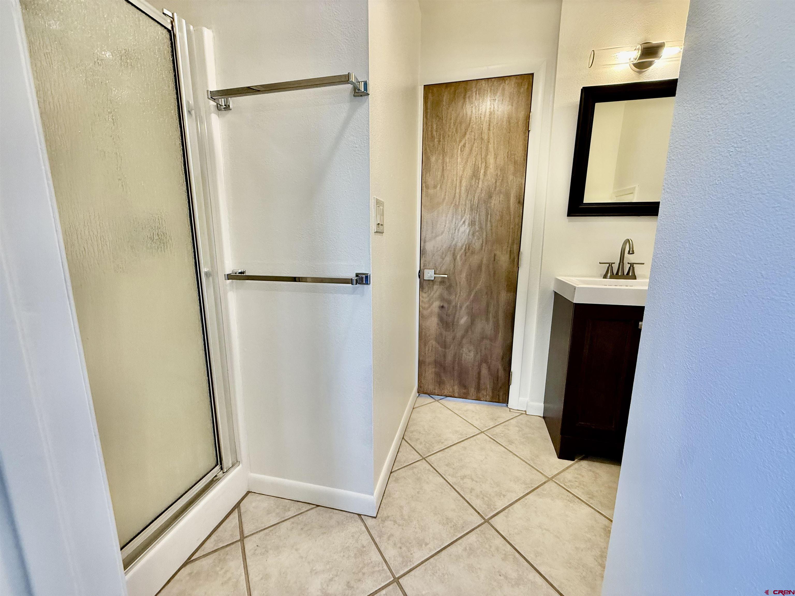 460 Fox Street Nucla, CO 81424 - Photo 19 of 33 a view of bathroom with a shower and a sink