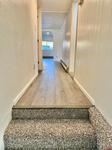 a view of an empty room and a window