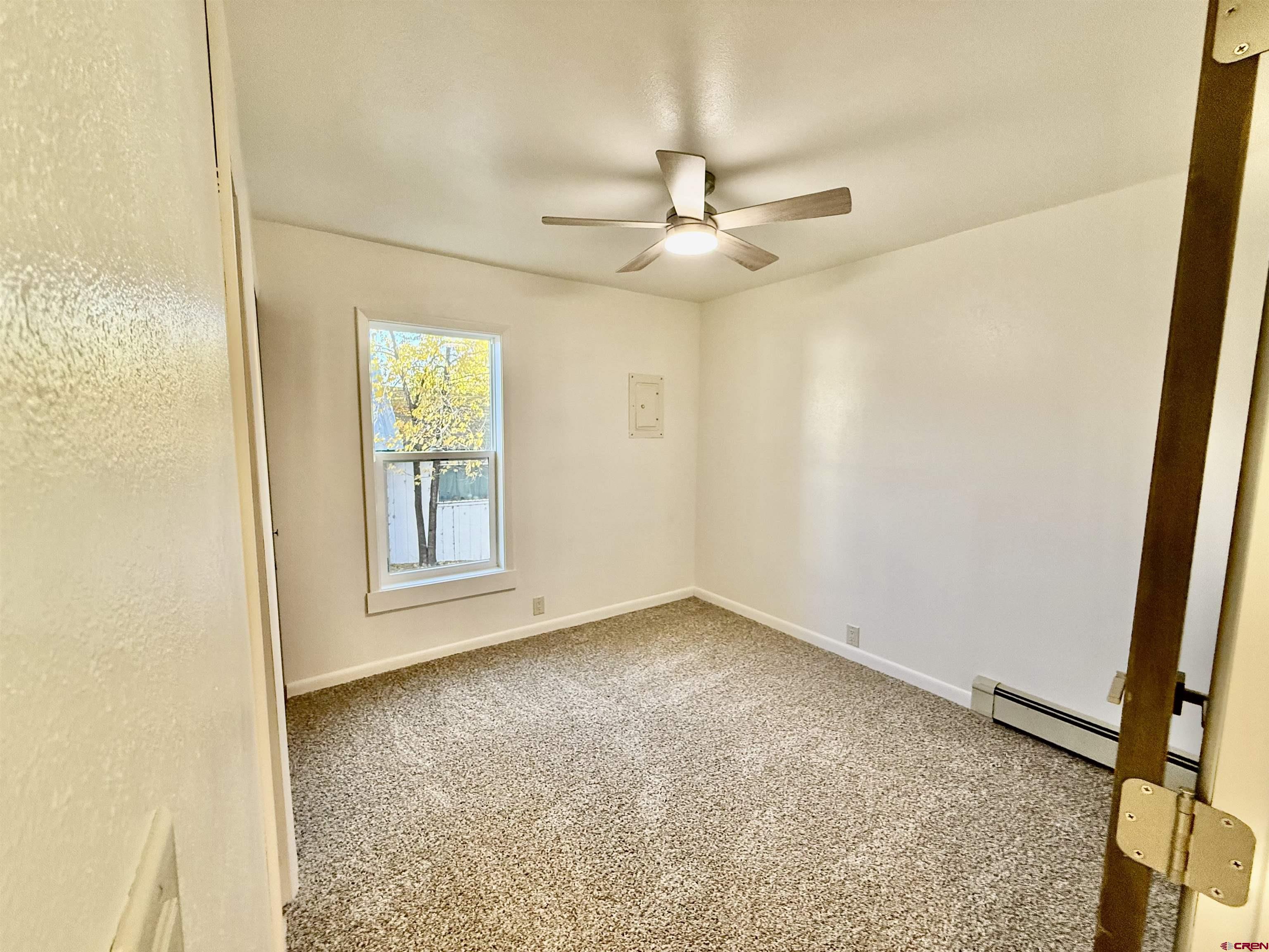 460 Fox Street Nucla, CO 81424 - Photo 24 of 33 an empty room with windows and fan