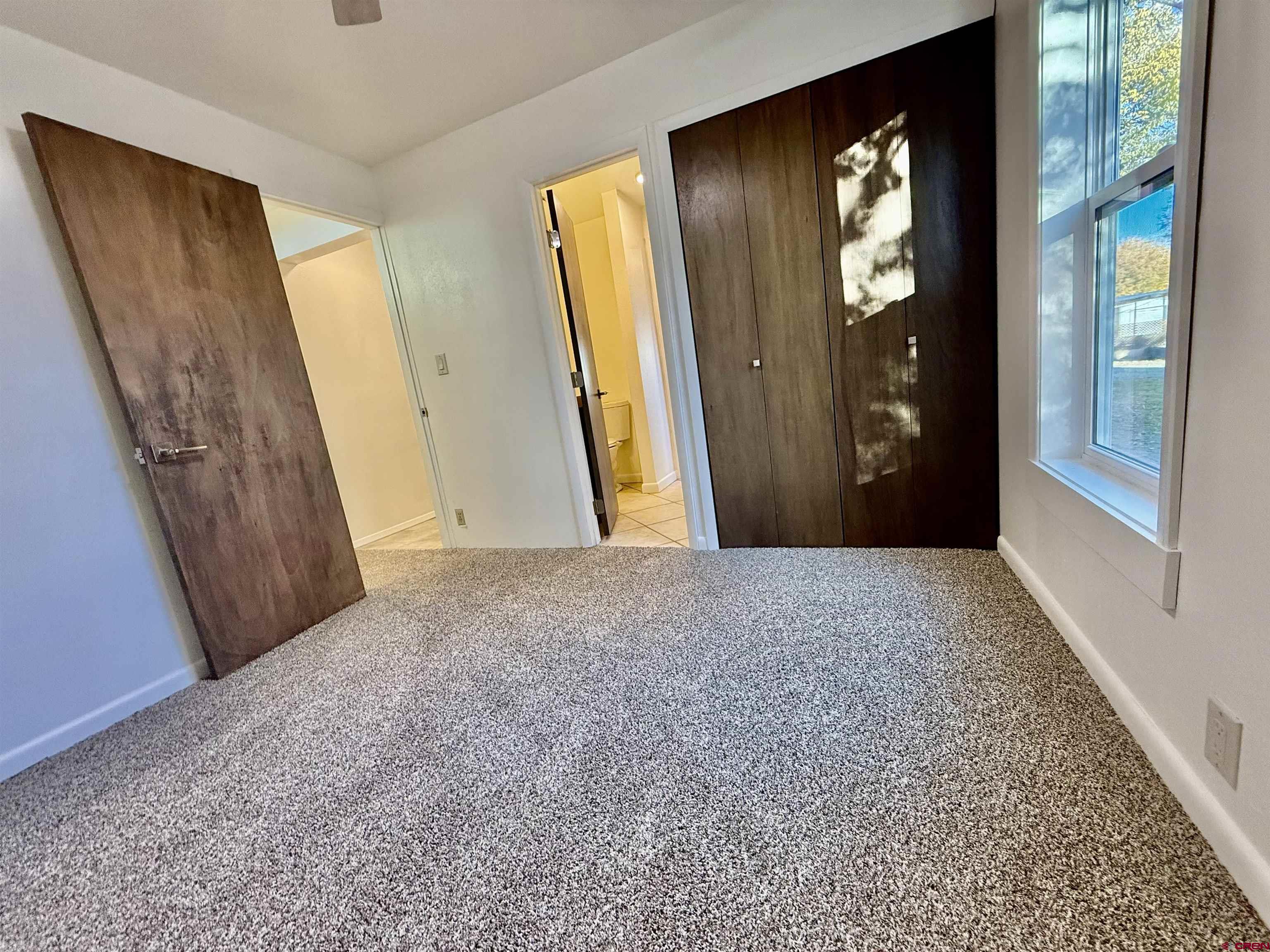 460 Fox Street Nucla, CO 81424 - Photo 25 of 33 a view of a hallway with wooden floor and front door