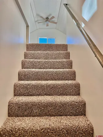 a view of an empty room and a window