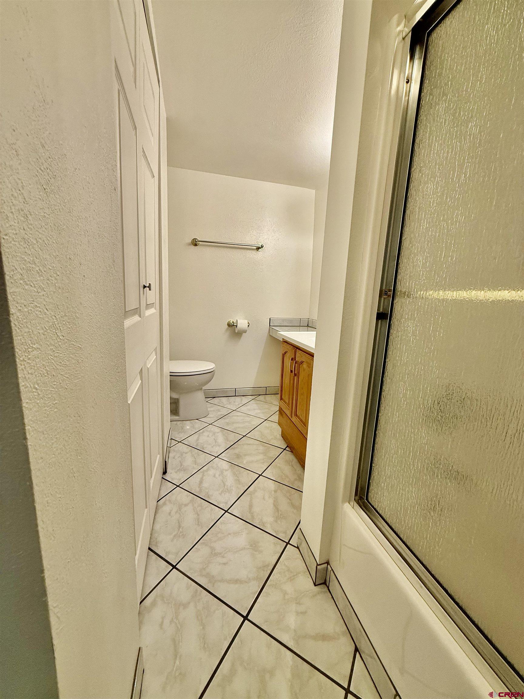 460 Fox Street Nucla, CO 81424 - Photo 33 of 33 a bathroom with a granite countertop sink and a mirror