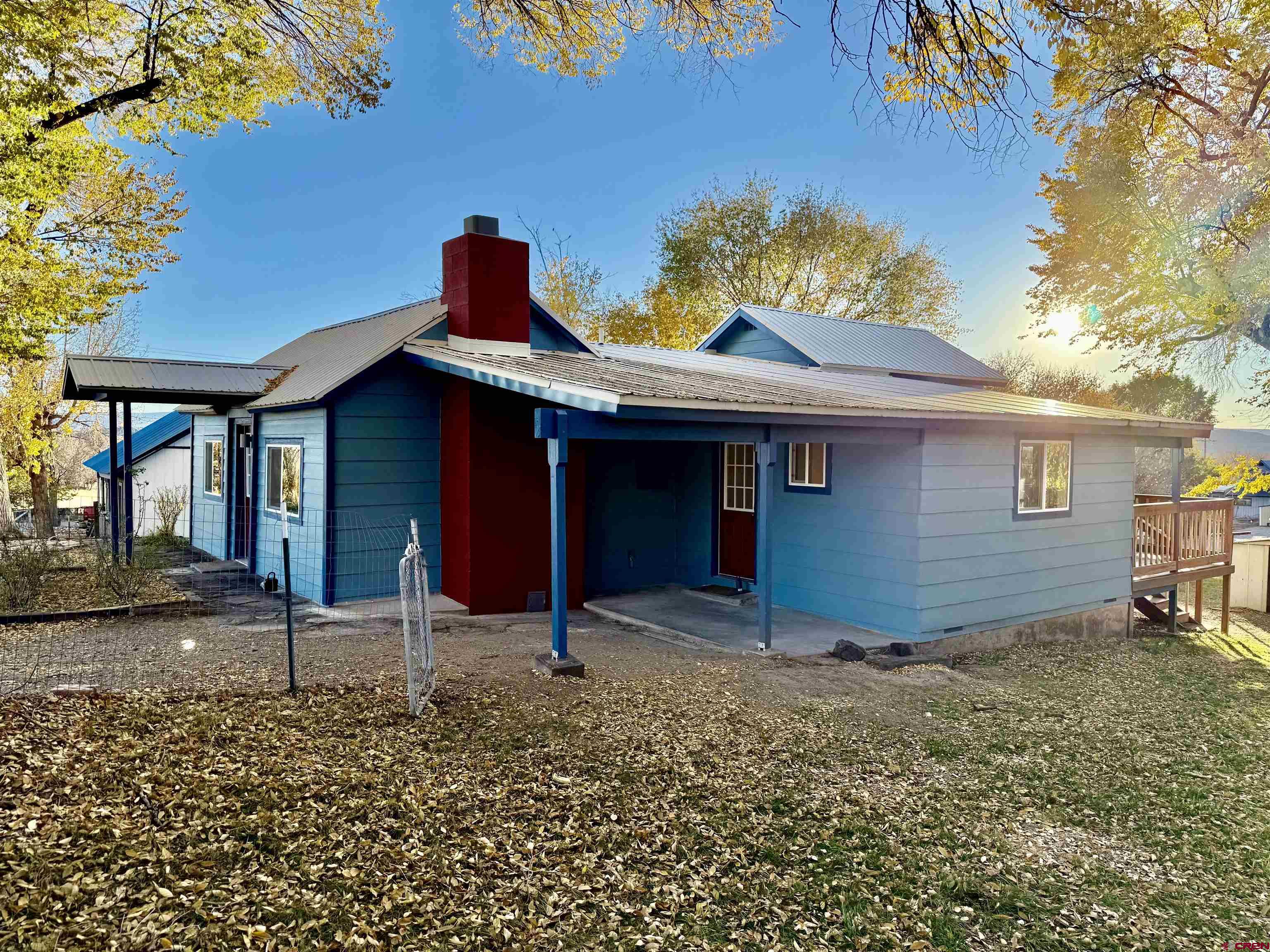 460 Fox Street Nucla, CO 81424 - Photo 4 of 33 a front view of a house with garden