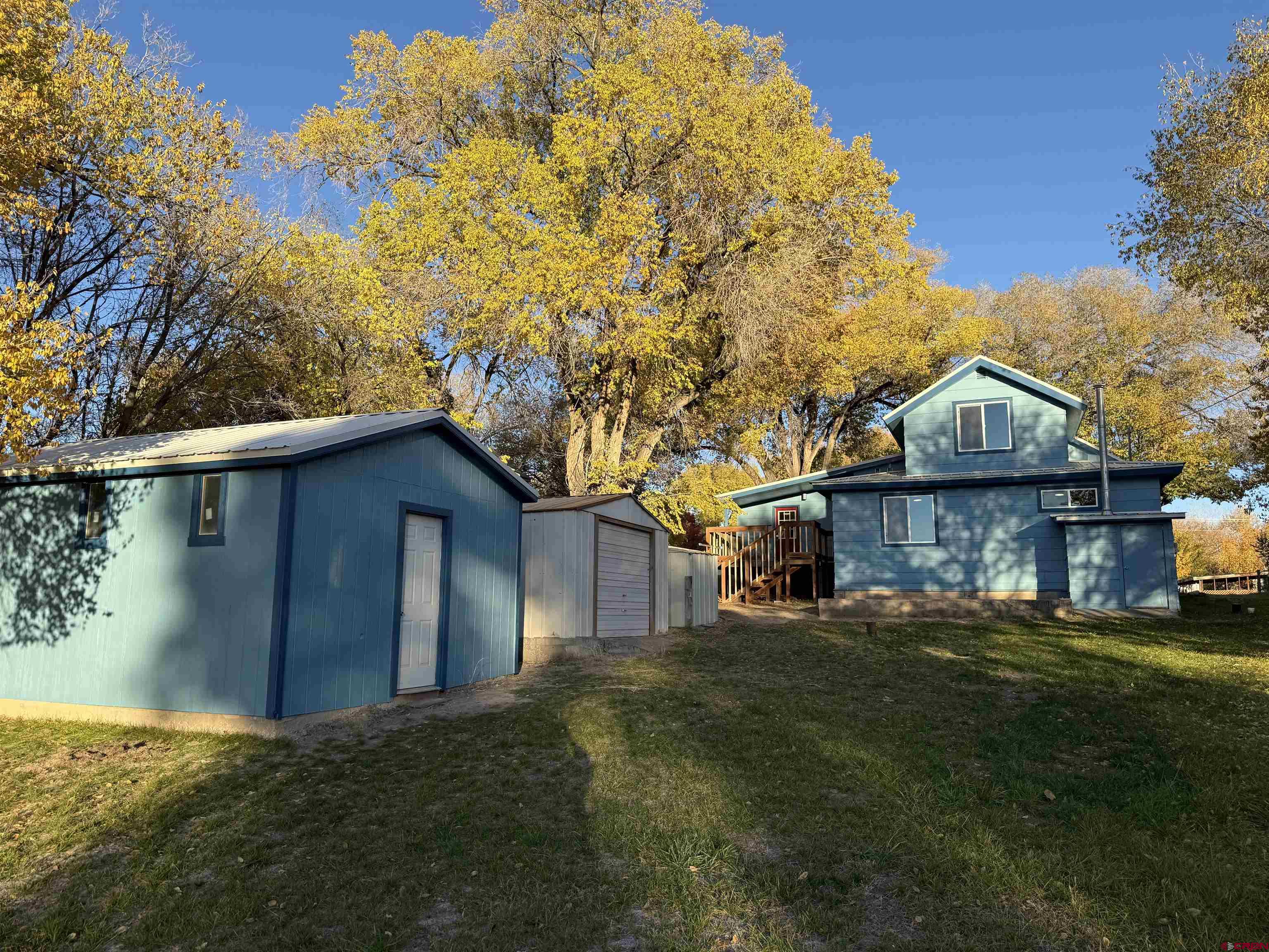460 Fox Street Nucla, CO 81424 - Photo 5 of 33 a view of a house with a yard