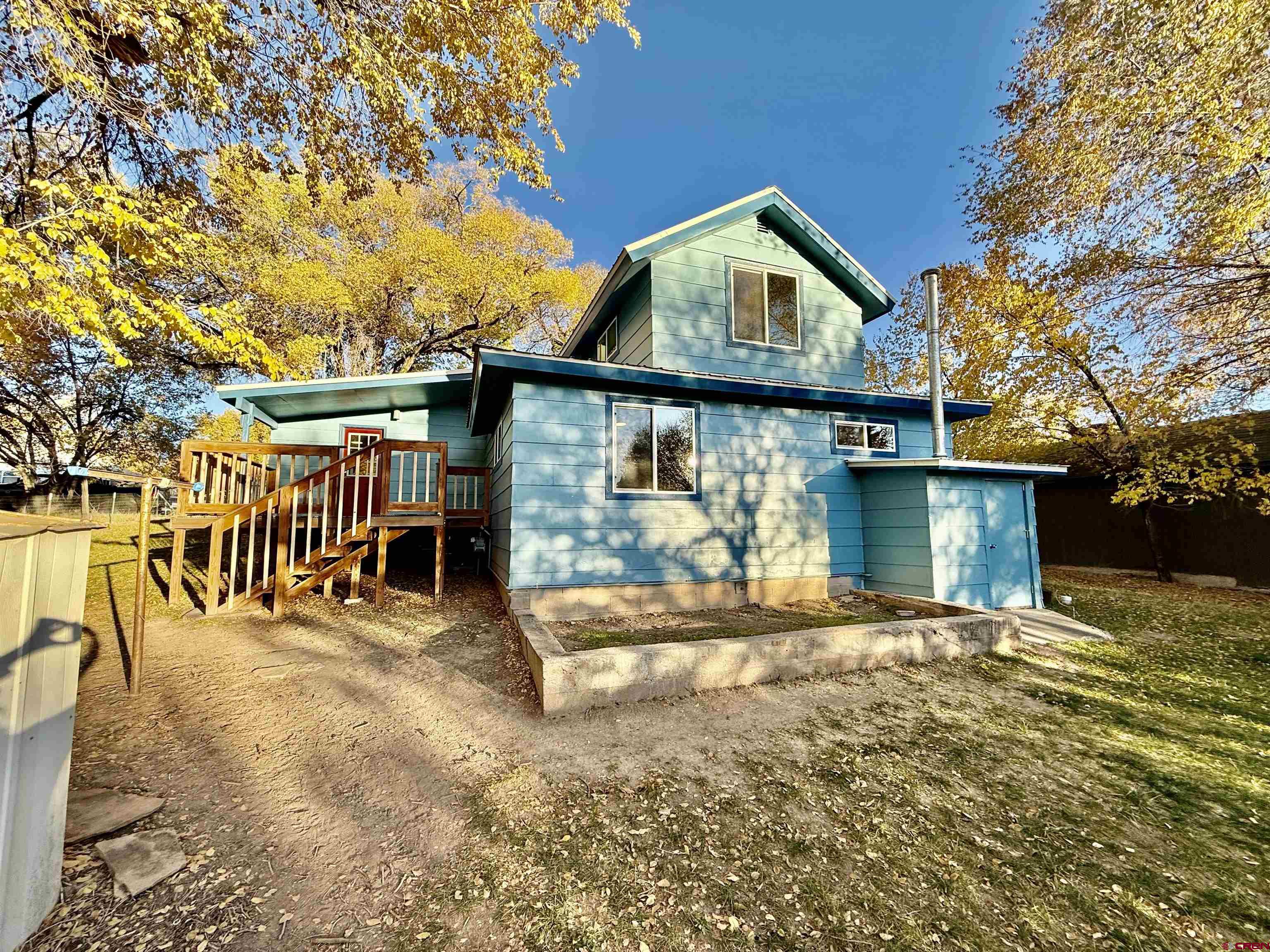 460 Fox Street Nucla, CO 81424 - Photo 6 of 33 a front view of a house with a yard