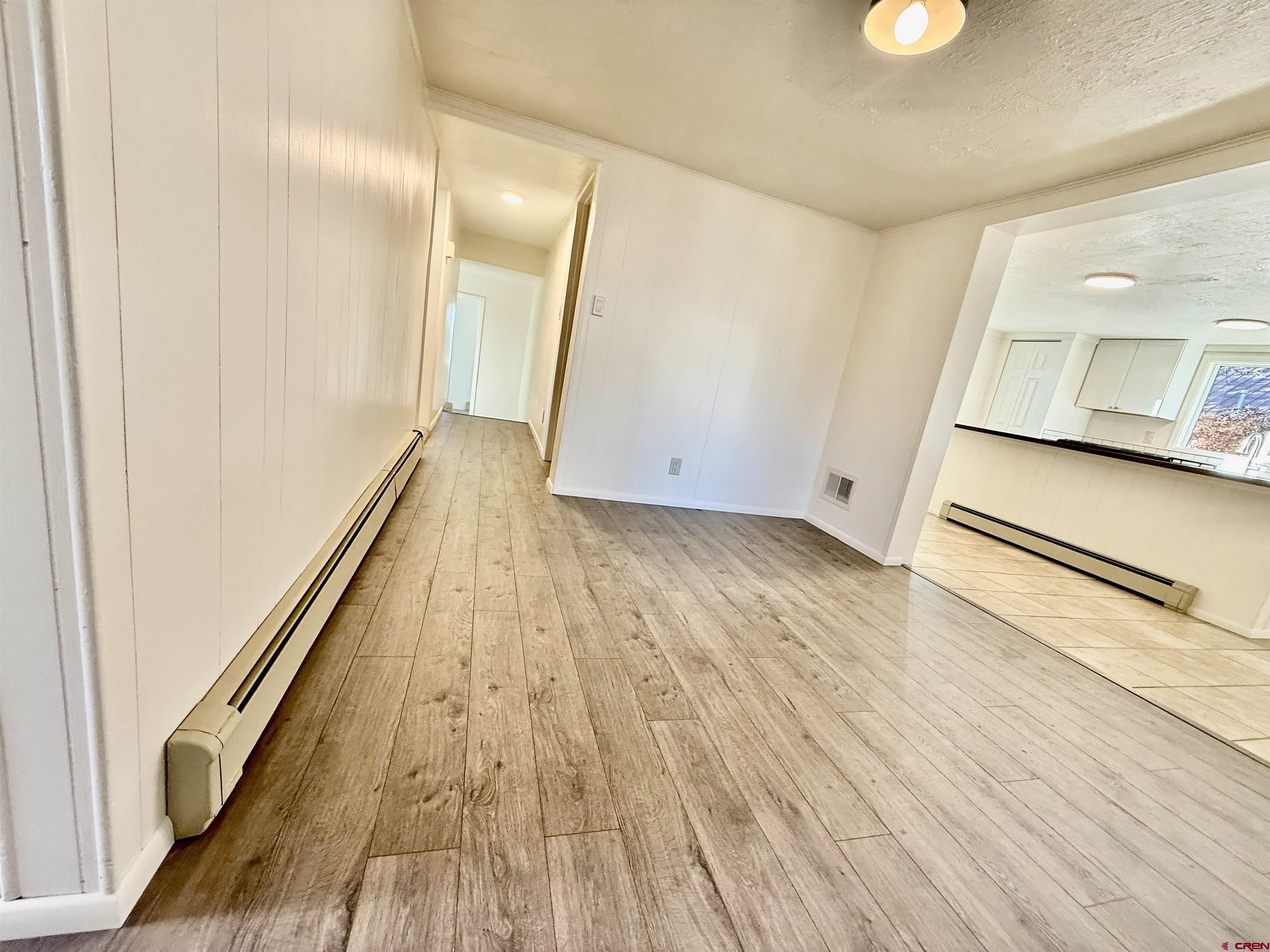 460 Fox Street Nucla, CO 81424 - Photo 9 of 33 wooden floor in an empty room with a window
