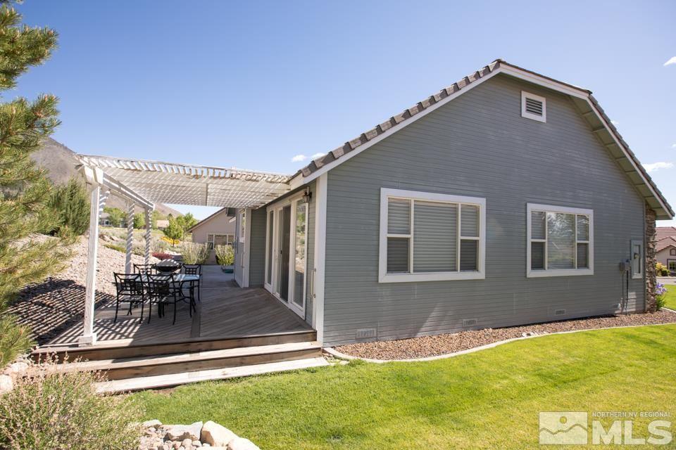 2456 Genoa Meadows Circle Genoa, NV 89411 - Photo 12 of 24 a backyard of a house with yard