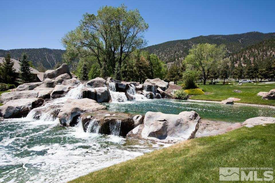 2456 Genoa Meadows Circle Genoa, NV 89411 - Photo 15 of 24 a view of a lake with houses