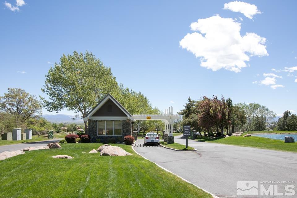 2456 Genoa Meadows Circle Genoa, NV 89411 - Photo 16 of 24 a view of house with backyard and garden