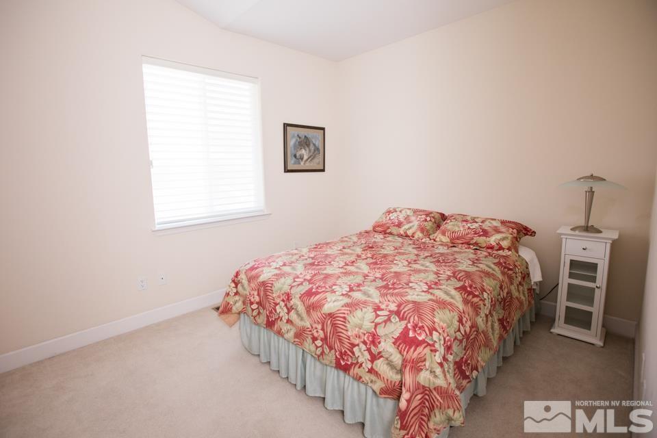 2456 Genoa Meadows Circle Genoa, NV 89411 - Photo 5 of 24 a bedroom with a bed and a window