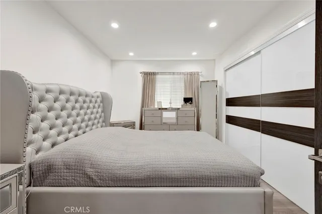 a large white bed in a white room