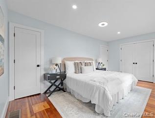 8563 98th Street Queens, NY 11421 - Photo 6 of 16 Bedroom featuring wood finished floors and recessed lighting