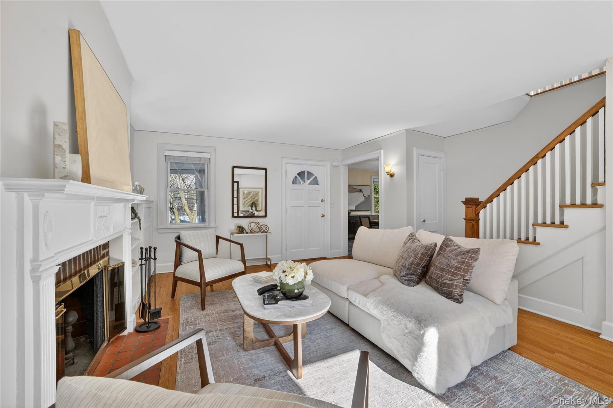 404 Bronxville Road Bronxville, NY 10708 - Photo 11 of 43 a living room with furniture and a fireplace
