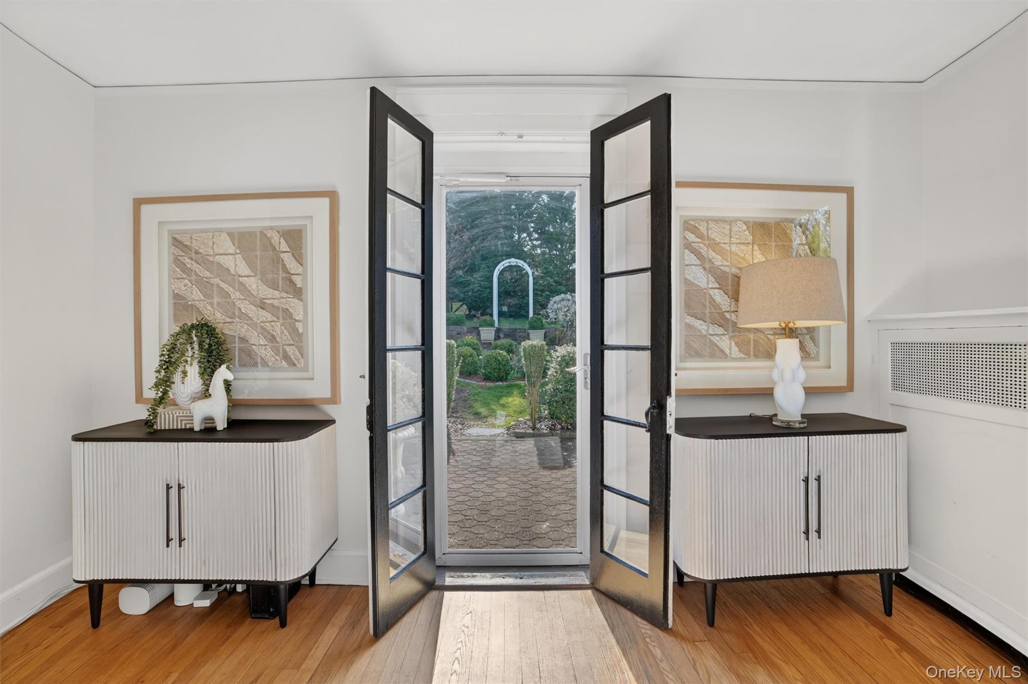 404 Bronxville Road Bronxville, NY 10708 - Photo 14 of 43 a view of hallway with a large window and wooden floor