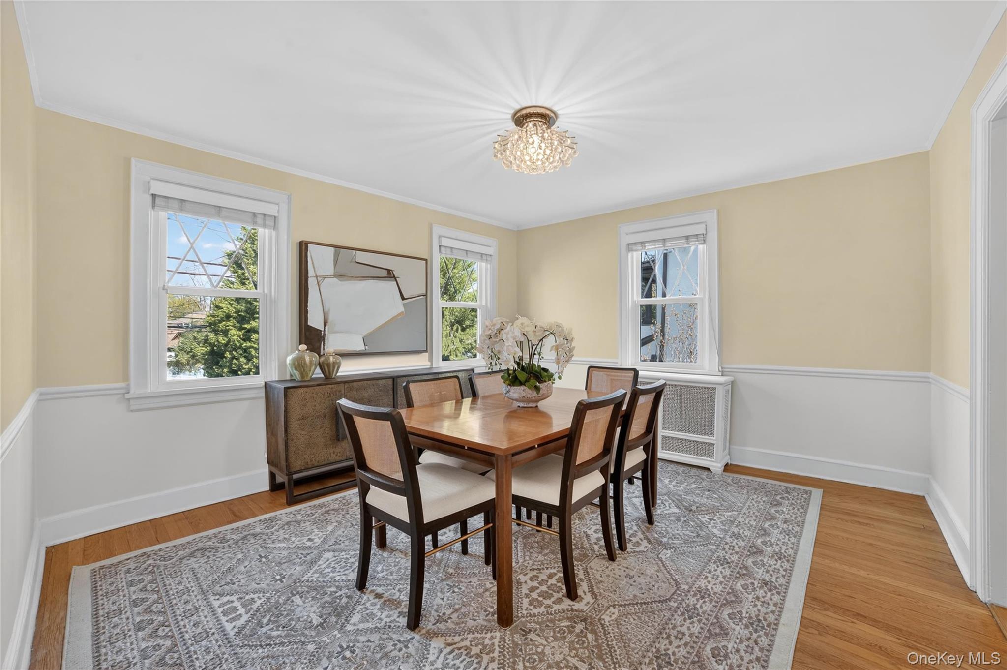 404 Bronxville Road Bronxville, NY 10708 - Photo 15 of 43 a view of a dining room with furniture window and wooden floor