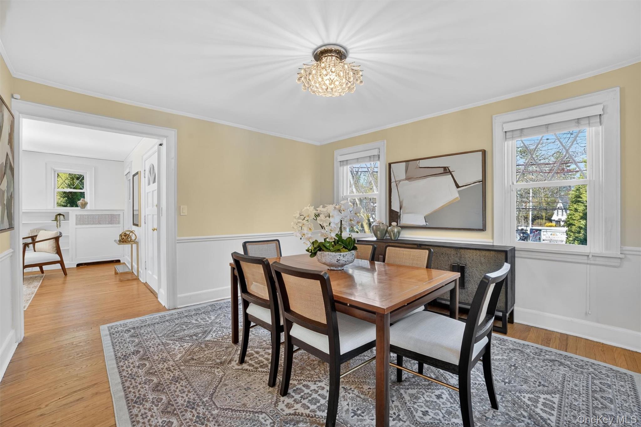 404 Bronxville Road Bronxville, NY 10708 - Photo 16 of 43 a view of a dining room with furniture and a chandelier