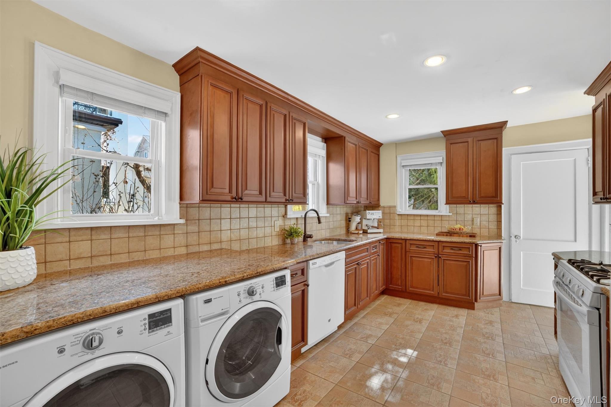 404 Bronxville Road Bronxville, NY 10708 - Photo 19 of 43 a kitchen with a sink cabinets and appliances
