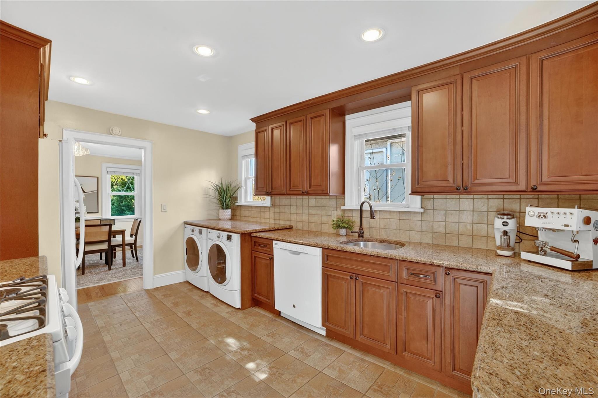404 Bronxville Road Bronxville, NY 10708 - Photo 20 of 43 a kitchen with sink cabinets and window