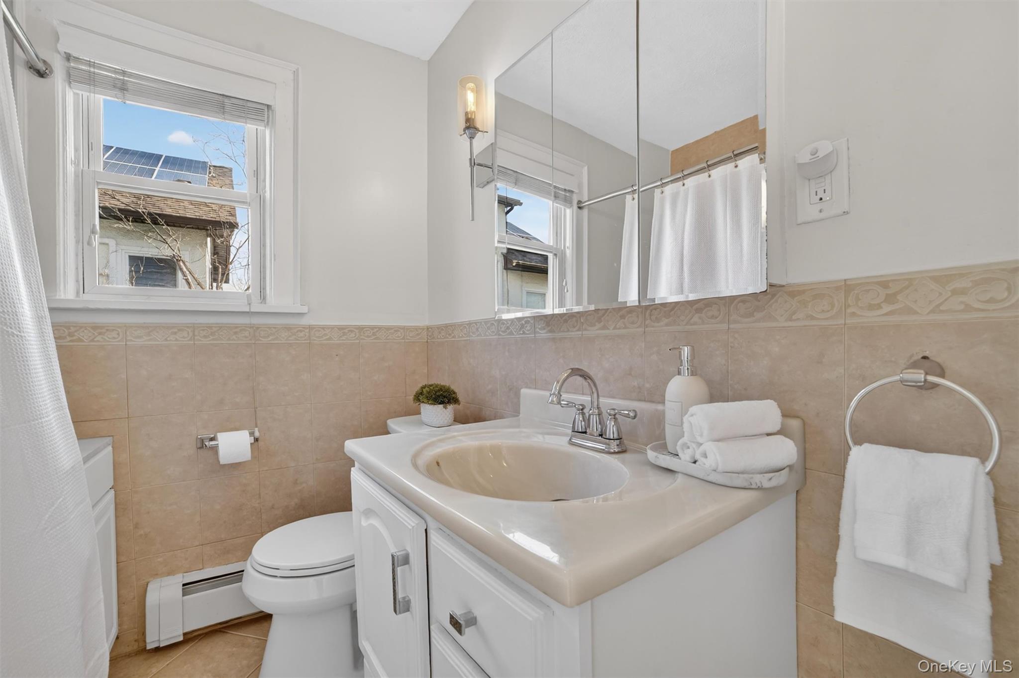 404 Bronxville Road Bronxville, NY 10708 - Photo 27 of 43 a bathroom with a sink and a toilet