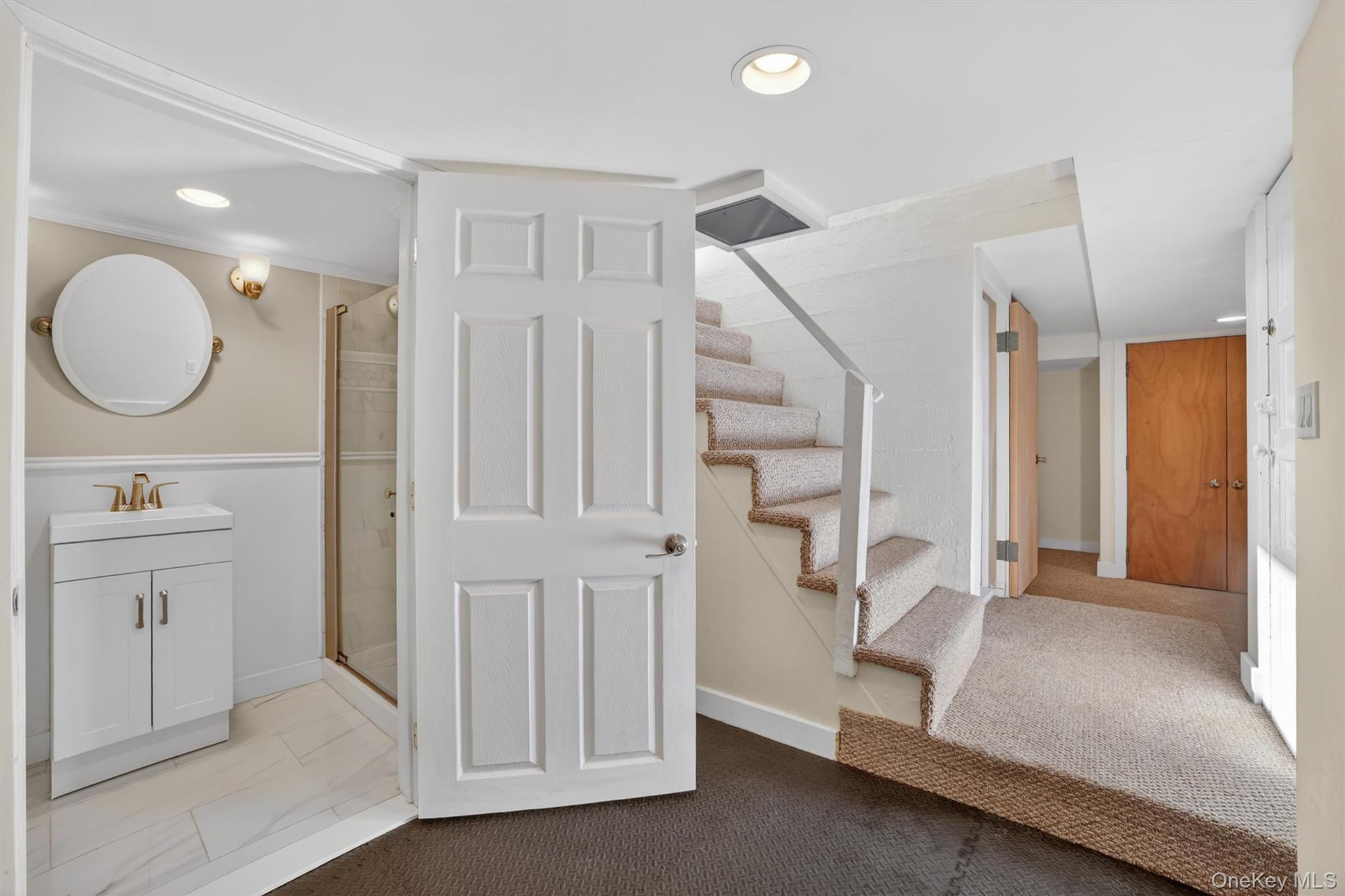404 Bronxville Road Bronxville, NY 10708 - Photo 31 of 43 a spacious bathroom with a double vanity sink and a mirror