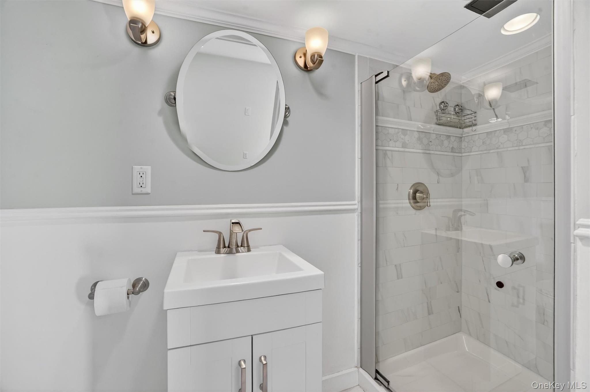 404 Bronxville Road Bronxville, NY 10708 - Photo 32 of 43 a bathroom with a sink a toilet and shower