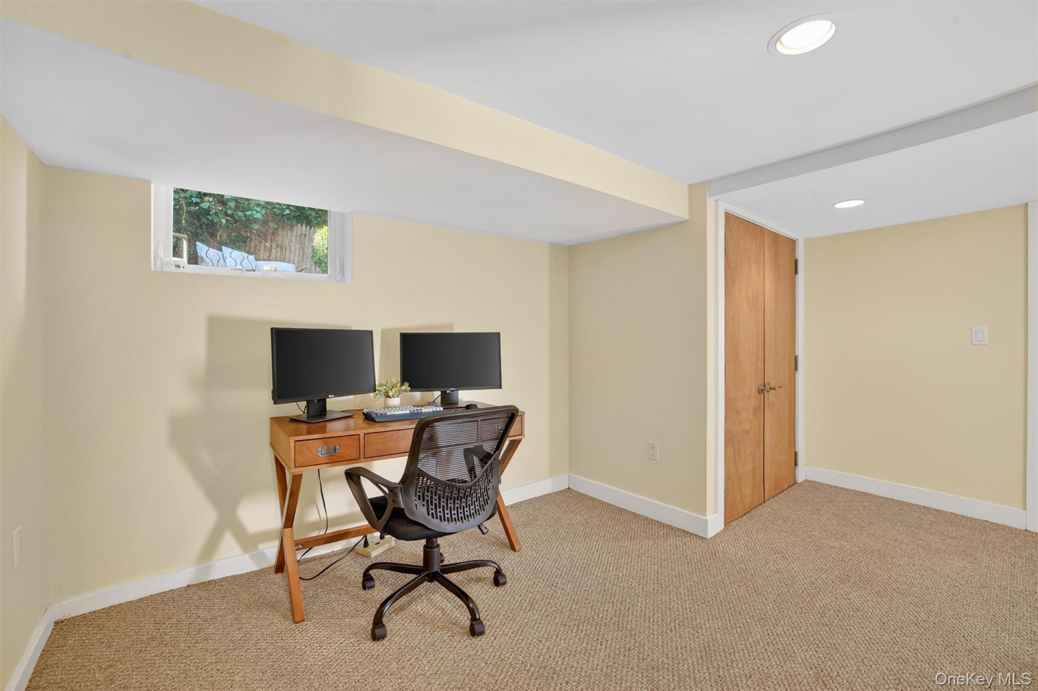 404 Bronxville Road Bronxville, NY 10708 - Photo 34 of 43 a view of a workspace with furniture and a window