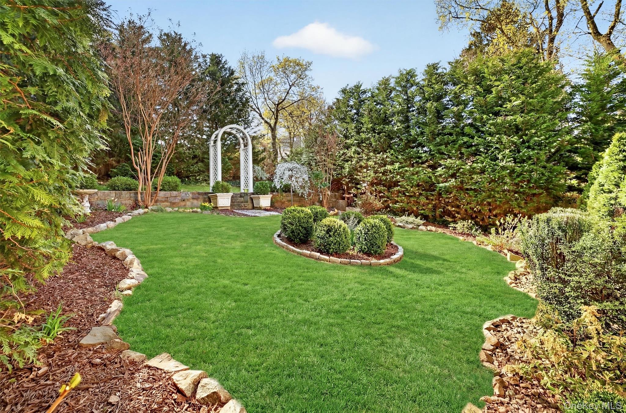 404 Bronxville Road Bronxville, NY 10708 - Photo 38 of 43 a view of a table and chairs in the garden