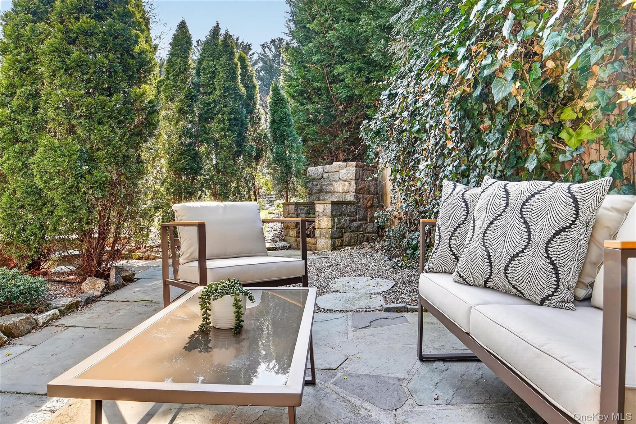 404 Bronxville Road Bronxville, NY 10708 - Photo 40 of 43 a view of a patio with couches and a fire pit