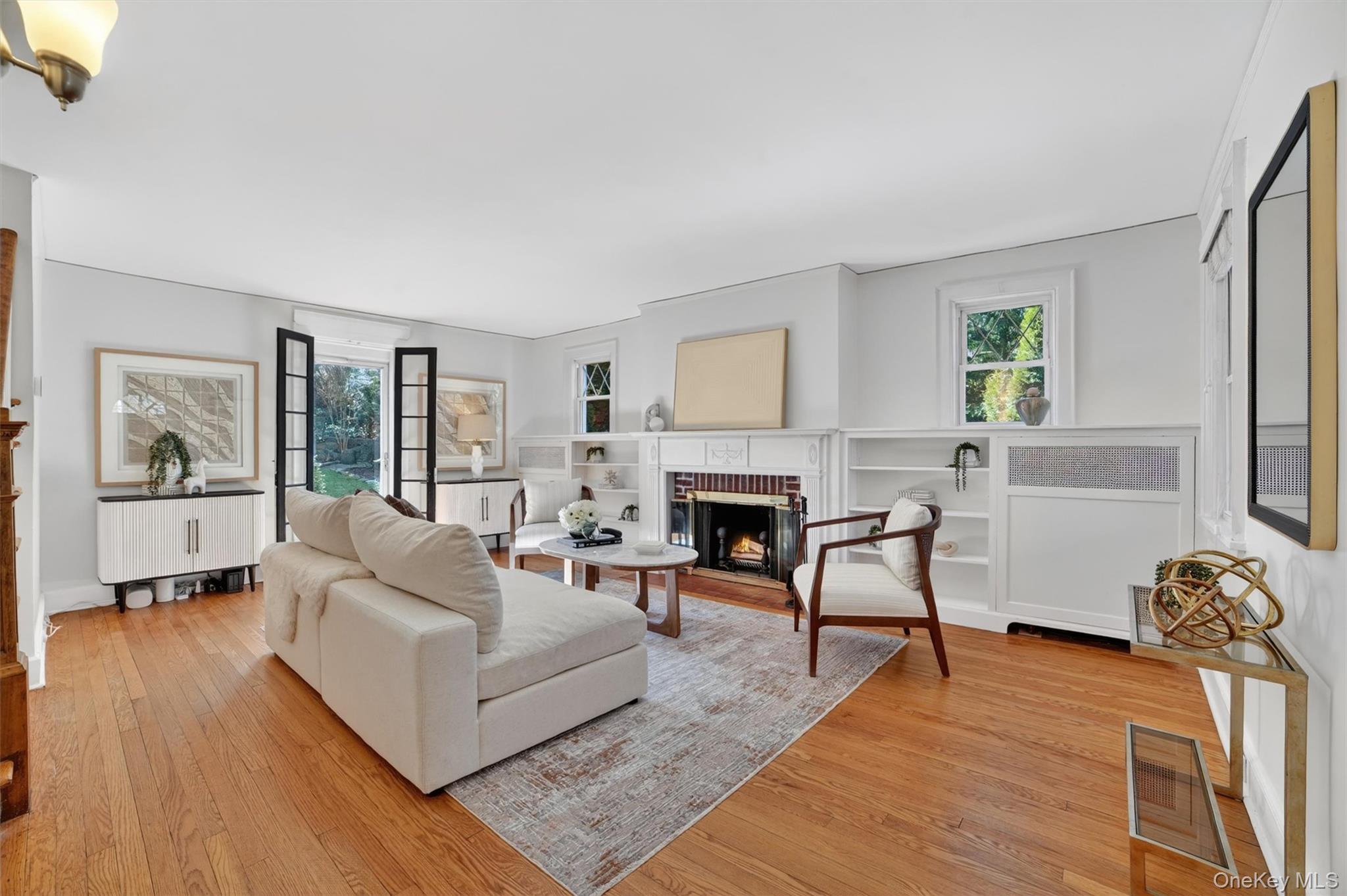 404 Bronxville Road Bronxville, NY 10708 - Photo 8 of 43 a living room with furniture a fireplace and a window