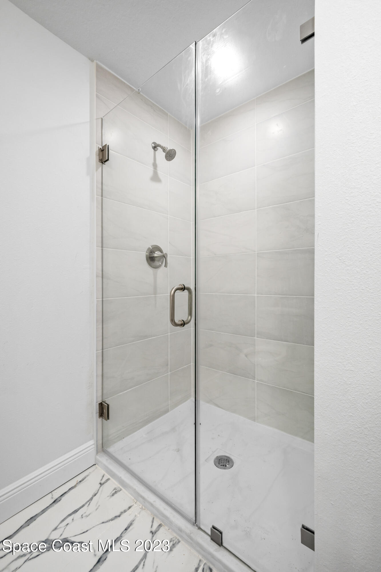735 Pilot Lane, Unit 313 Merritt Island, FL 32952 - Photo 11 of 20 a bathroom with a shower