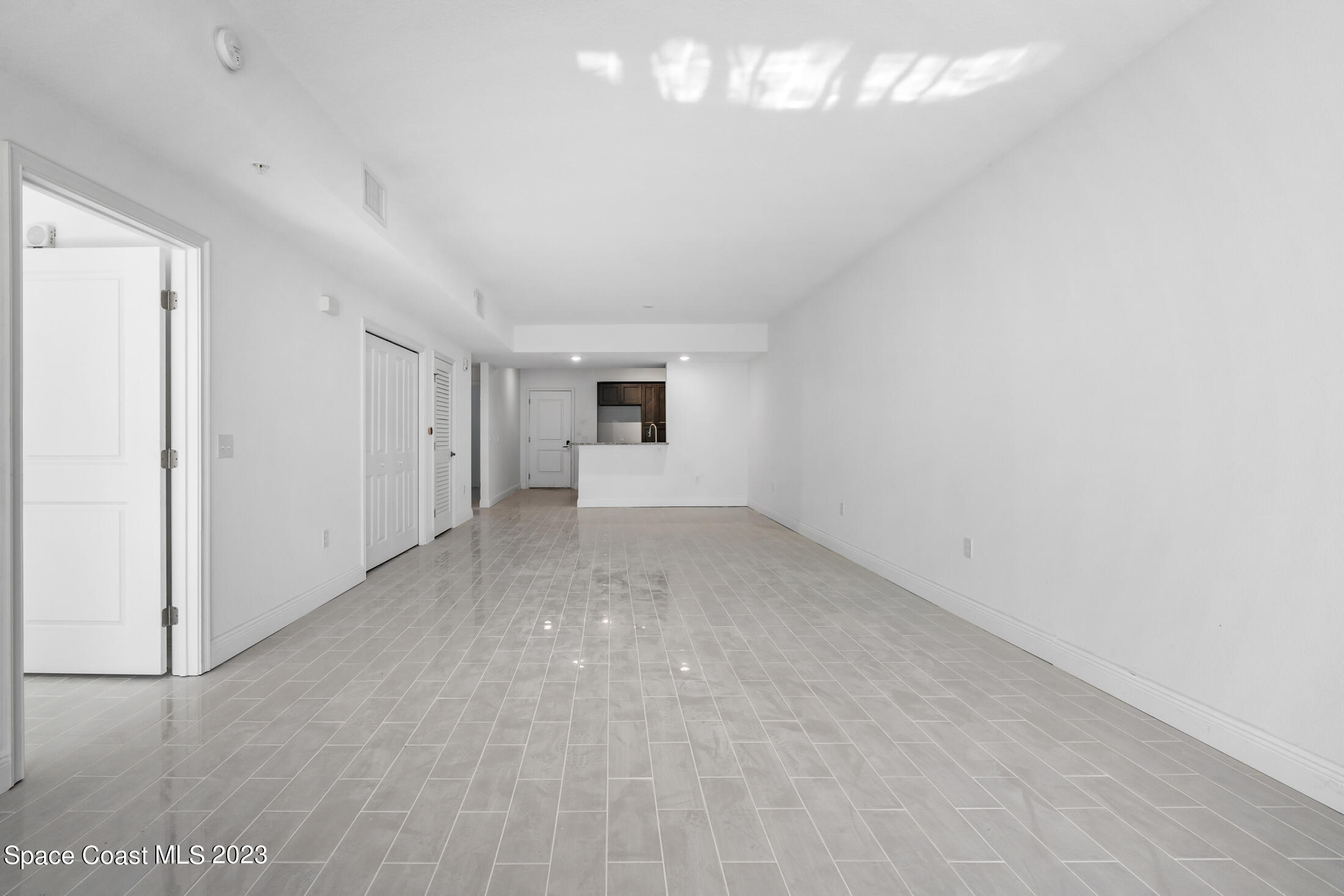 735 Pilot Lane, Unit 313 Merritt Island, FL 32952 - Photo 2 of 20 a view of empty room with windows