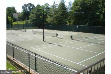 12151 Penderview Lane, Unit 2038 Fairfax, VA 22033 - Photo 15 of 18 a terrace with trees in front of it