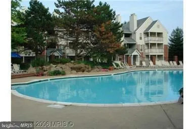 a view of swimming pool with a yard