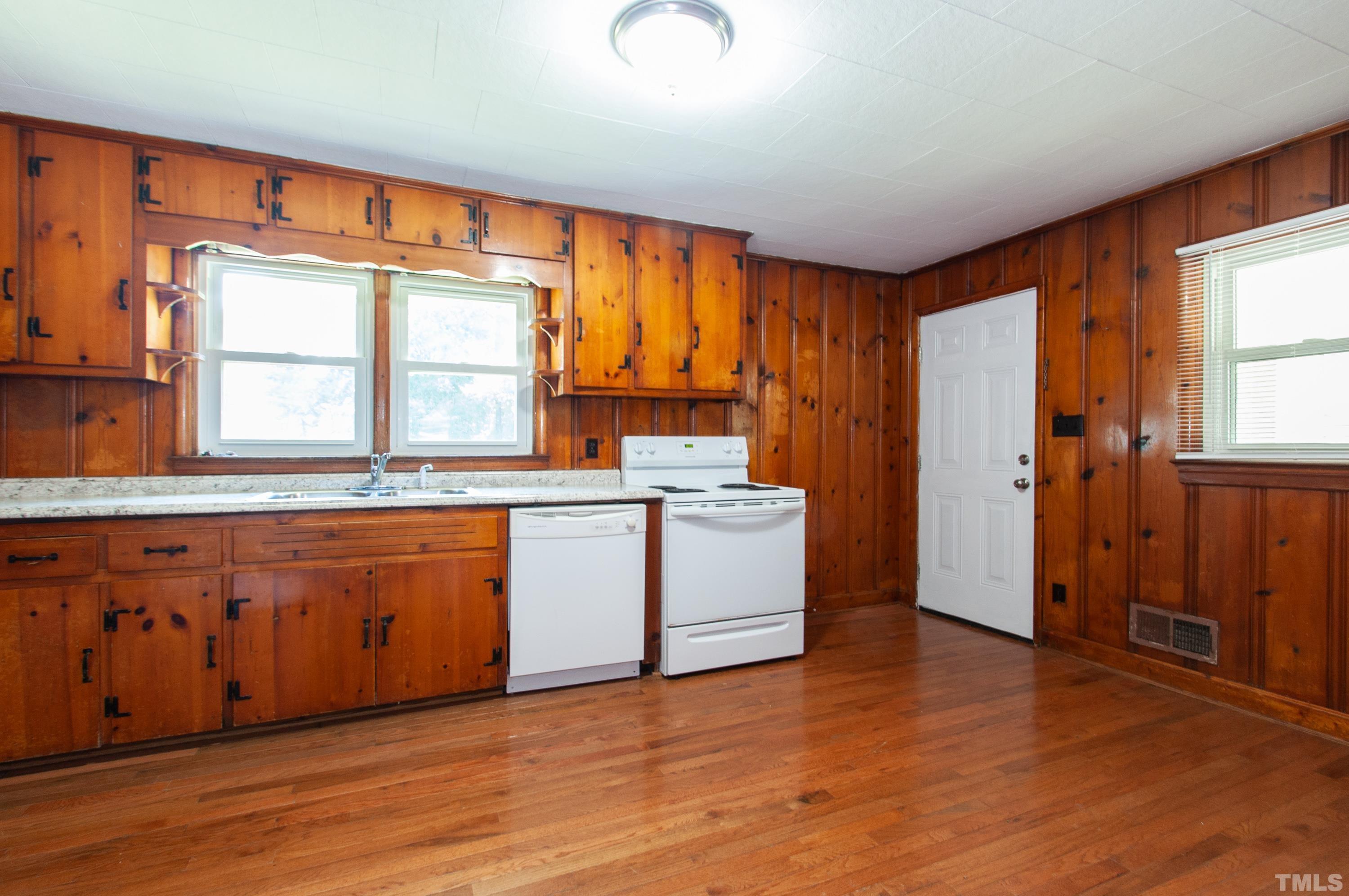 5111 Old Stage Road Raleigh, NC 27603 - Photo 13 of 29 a view of a kitchen with wooden floor and electronic appliances
