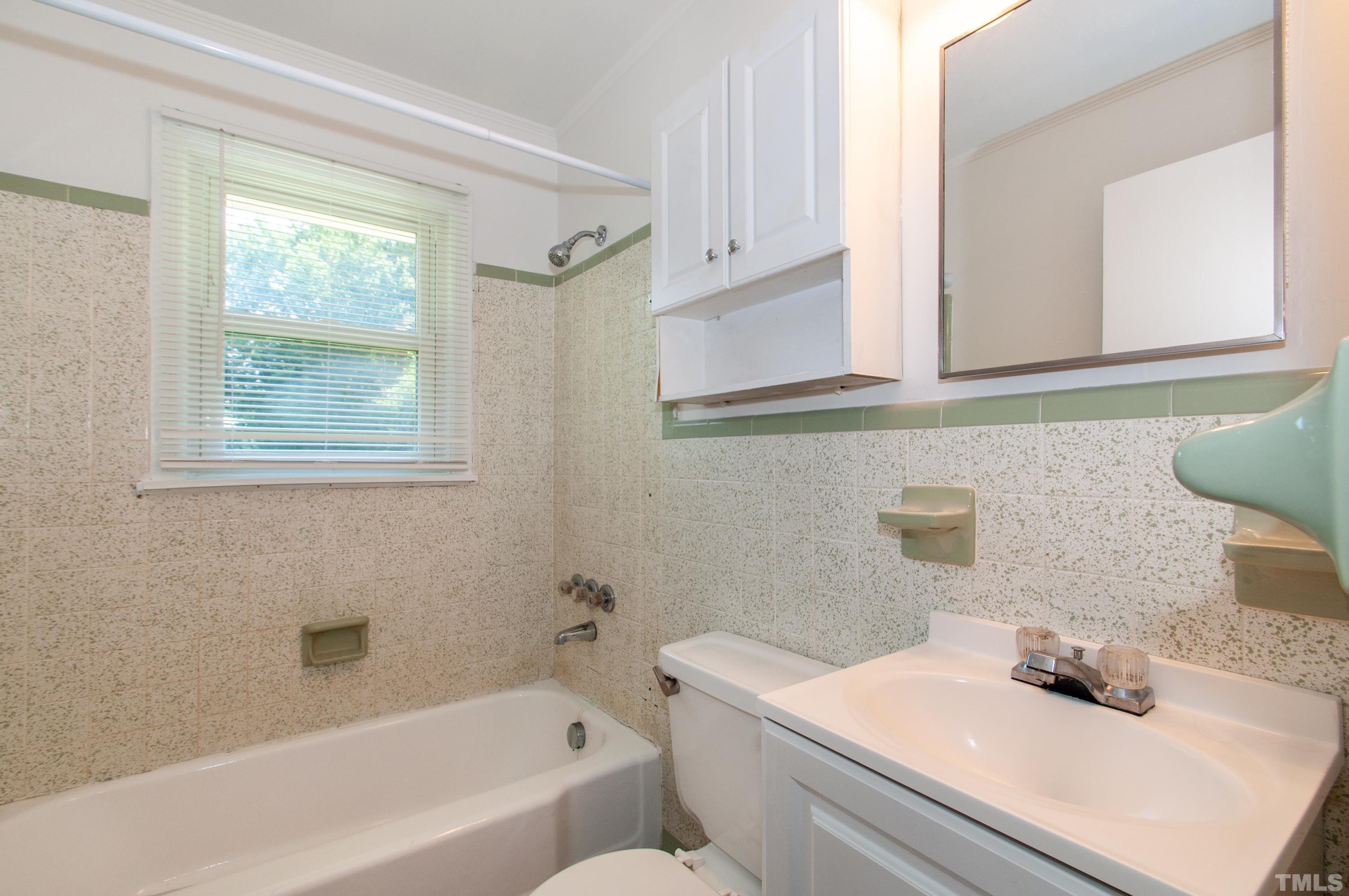 5111 Old Stage Road Raleigh, NC 27603 - Photo 18 of 29 a bathroom with a sink and a bathtub