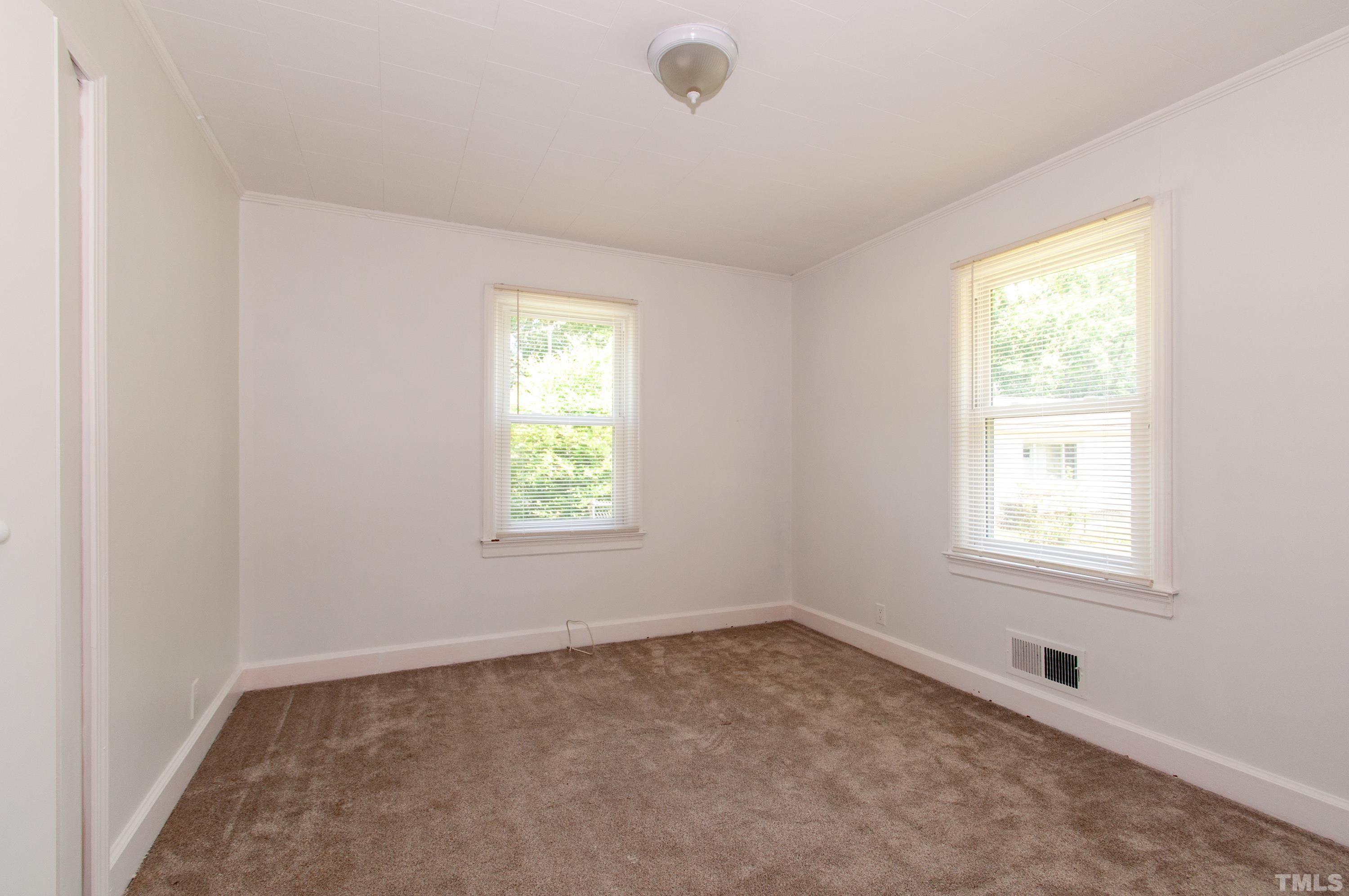 5111 Old Stage Road Raleigh, NC 27603 - Photo 19 of 29 an empty room with a window