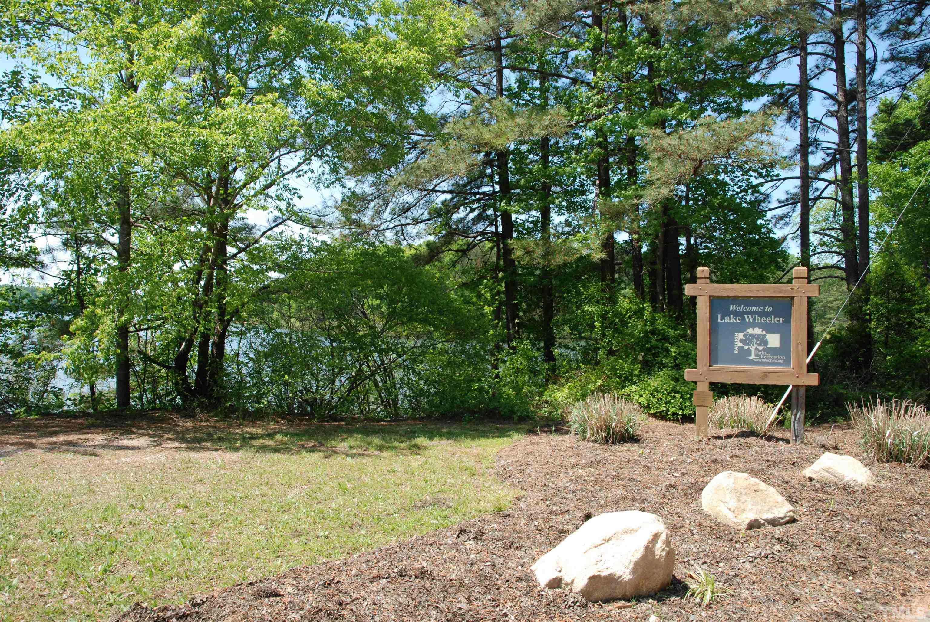 5111 Old Stage Road Raleigh, NC 27603 - Photo 29 of 29 a backyard of a house with lots of green space