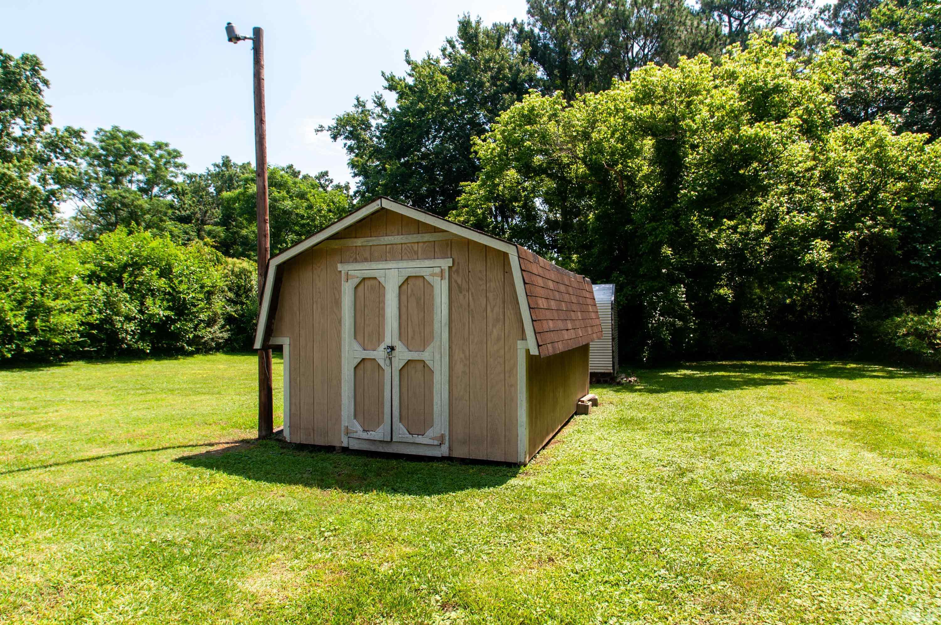 5111 Old Stage Road Raleigh, NC 27603 - Photo 3 of 29 a view of backyard with tub and trees