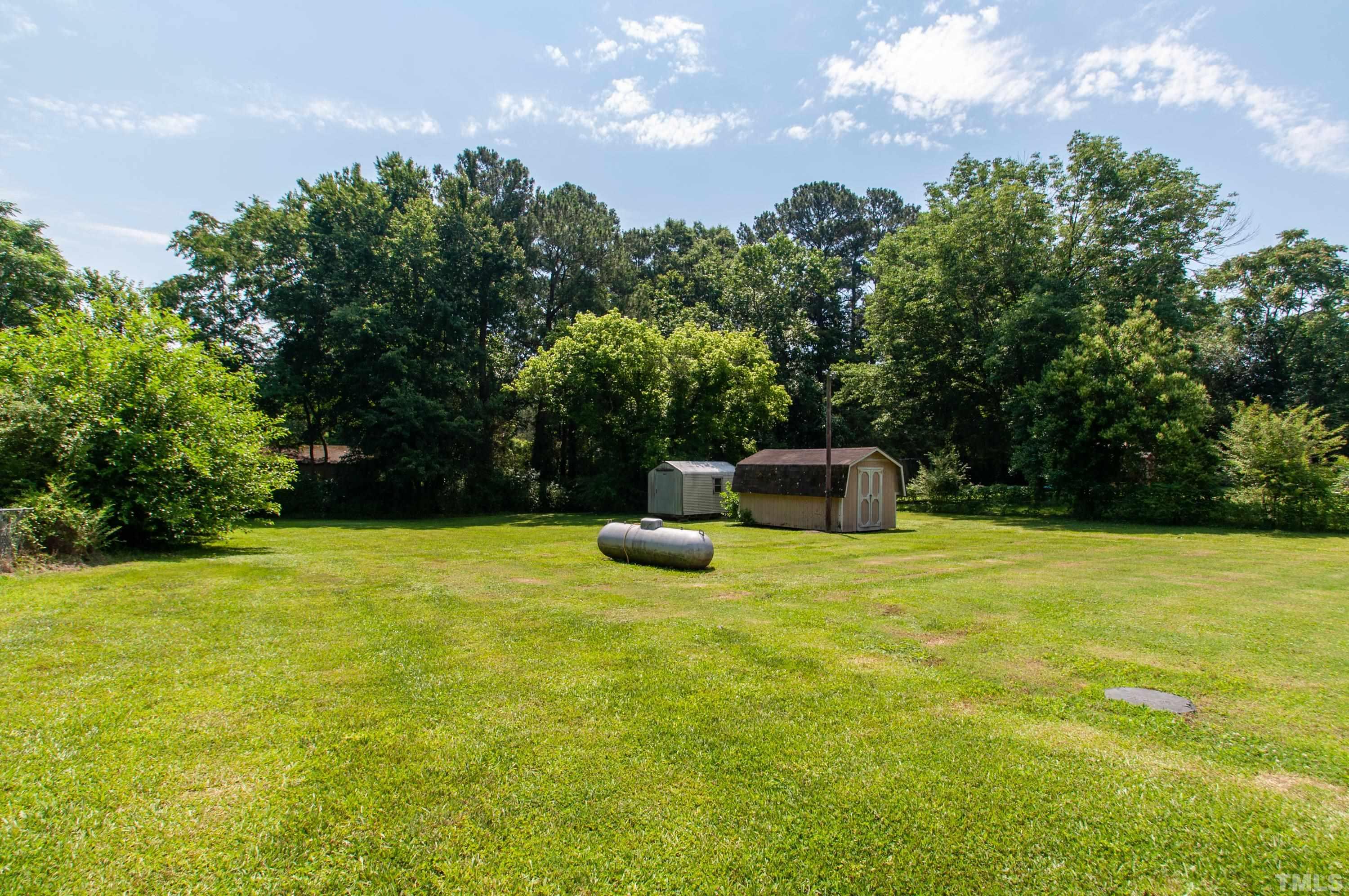 5111 Old Stage Road Raleigh, NC 27603 - Photo 5 of 29 a view of a garden with a slide and a lake view
