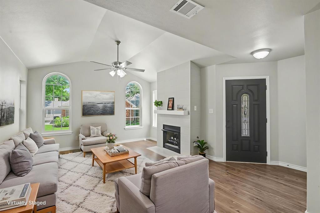 6113 Haley Lane Fort Worth, TX 76132 - Photo 6 of 38 Virtually Staged Living Room with updated Fireplace, updated Ceiling fan, updated light fixtures, new flooring, vaulted ceiling