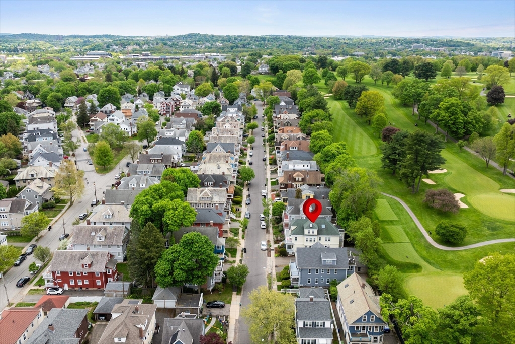 17 Commonwealth Road, Unit 1 Watertown, MA 02472 - Photo 4 of 6 an aerial view of residential houses with outdoor space