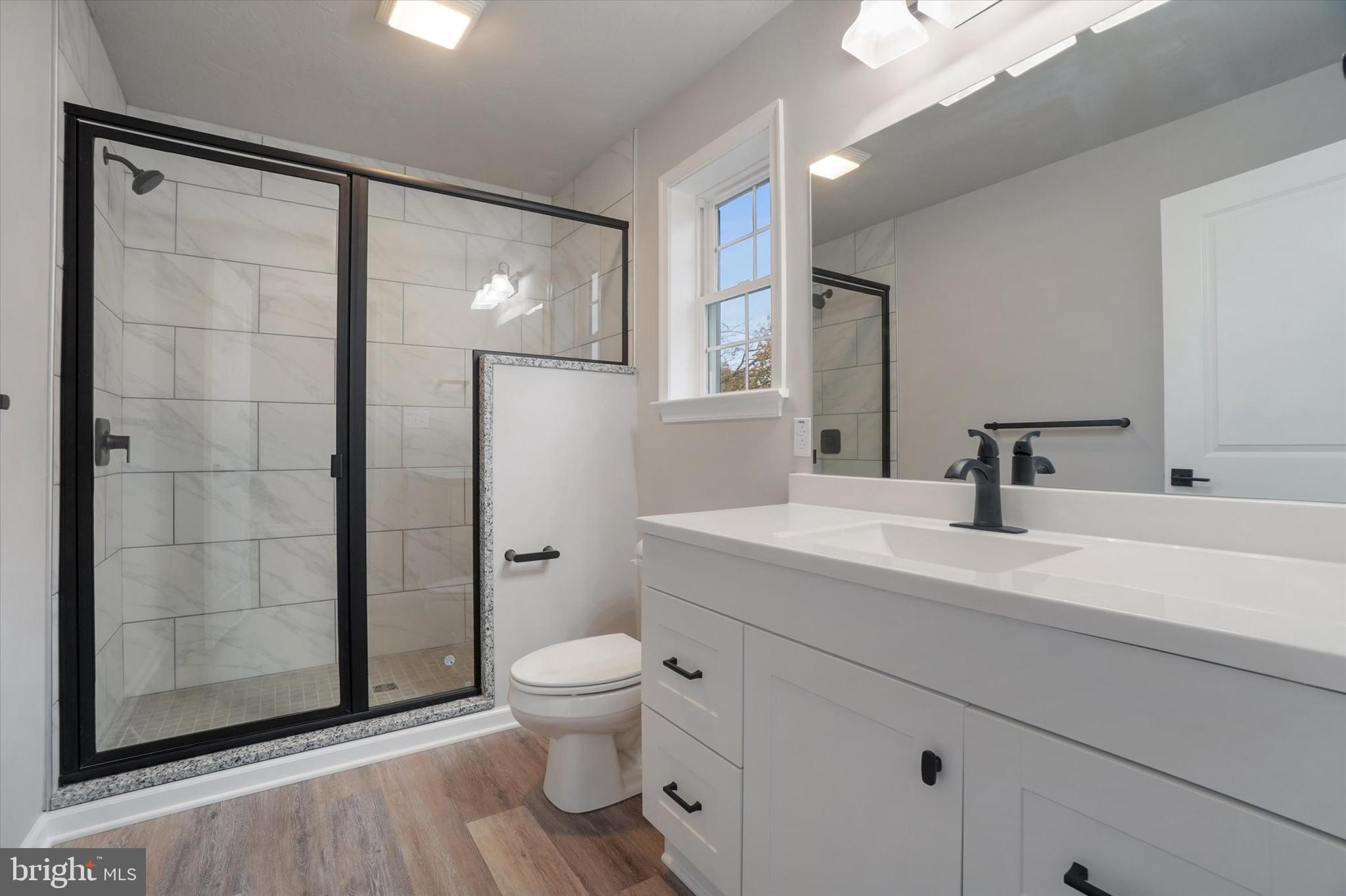 5 Fuhrman Mill Road Hanover, PA 17331 - Photo 13 of 16 a bathroom with a toilet sink and shower