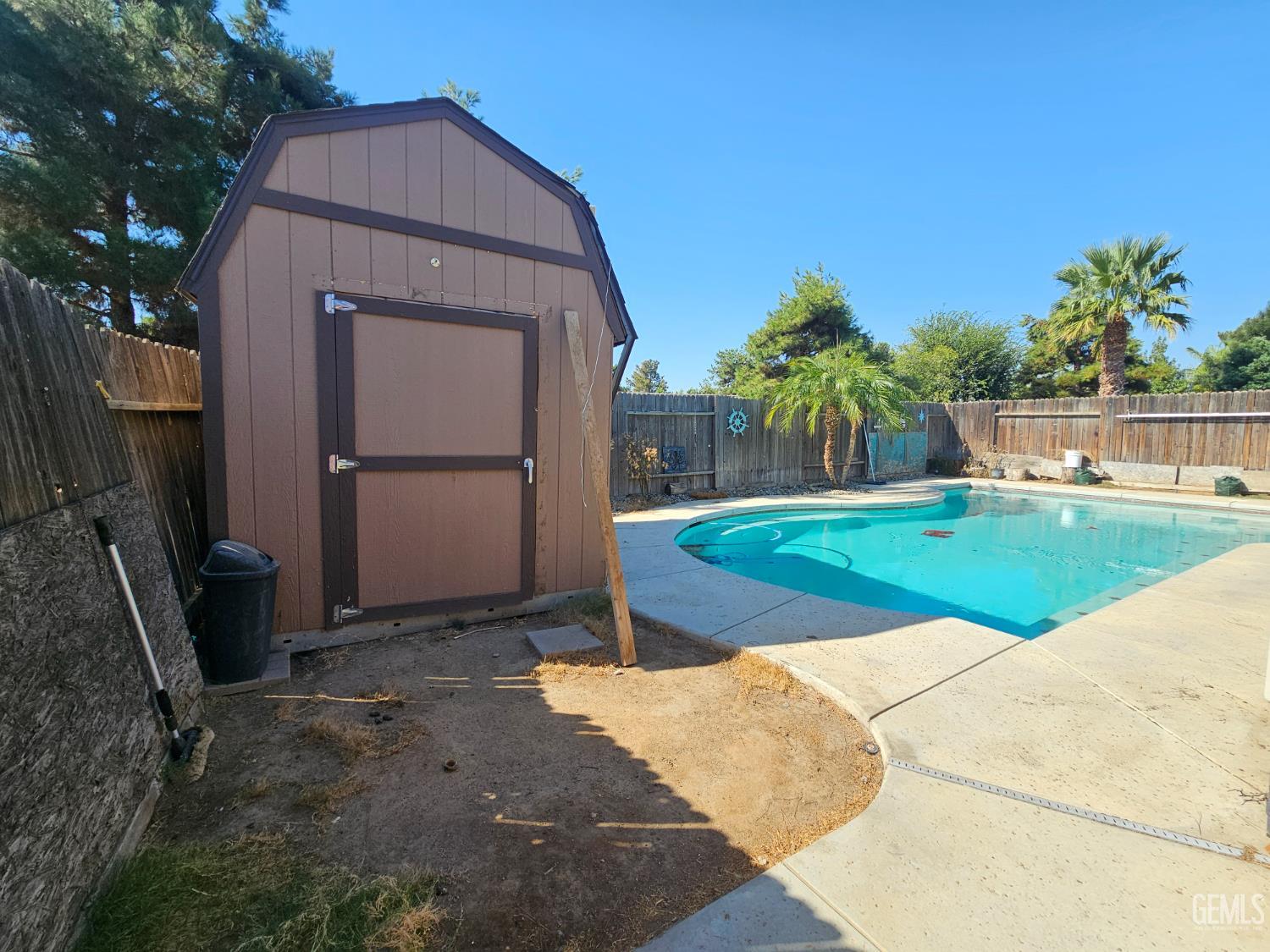 Undisclosed Address Bakersfield, CA 93308 - Photo 11 of 11 a view of a house with a yard