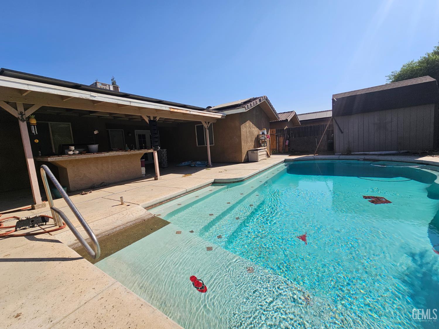 Undisclosed Address Bakersfield, CA 93308 - Photo 7 of 11 a view of backyard with swimming pool and seating space