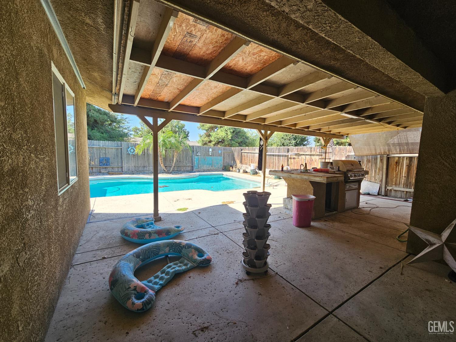 Undisclosed Address Bakersfield, CA 93308 - Photo 10 of 11 a view of a backyard with table and chairs