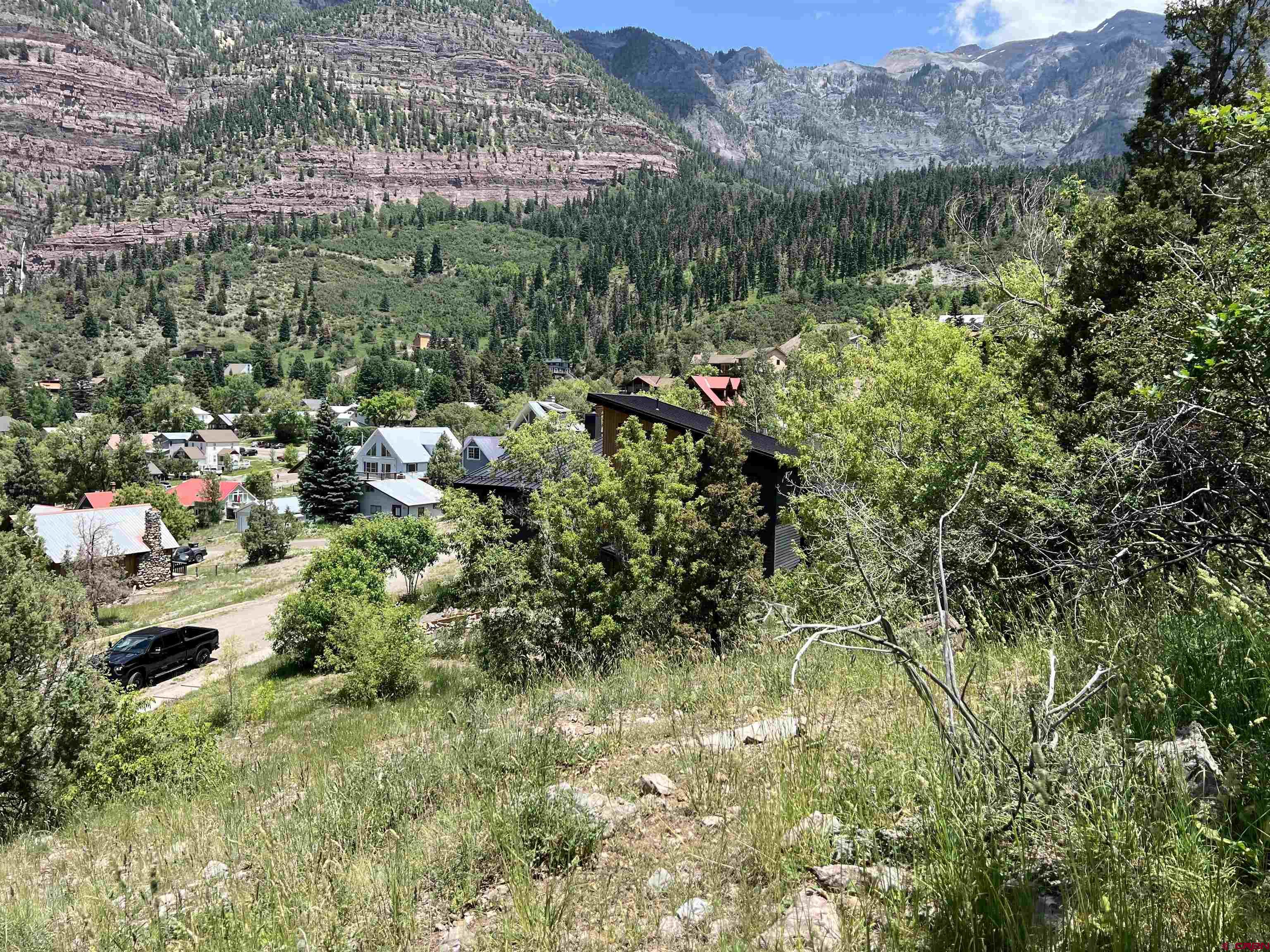 325 2nd Street Ouray, CO 81427 - Photo 17 of 23 a view of a garden with a building in the background