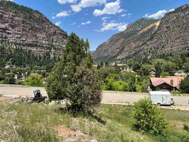 a view of a garden with a house
