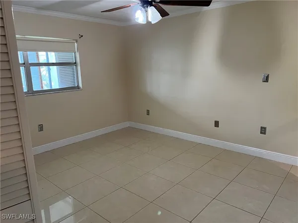 en empty room with windows